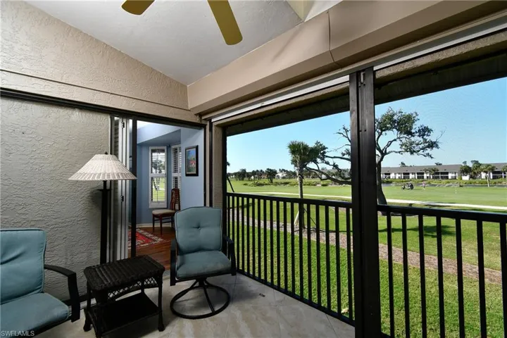 Sunroom / solarium with ceiling fan and lofted ceiling