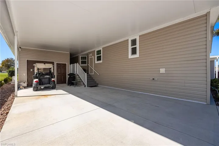 View of patio / terrace featuring an attached carport