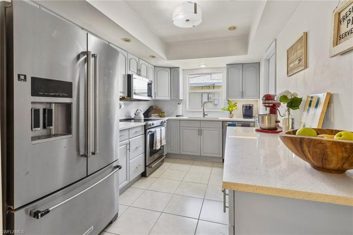 Quartz countertops highlight this remodeled kitchen