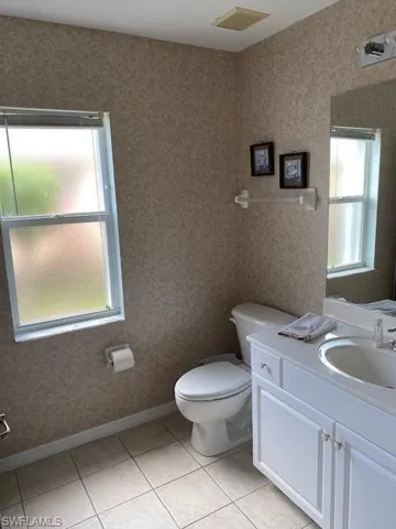 Bathroom featuring vanity and light tile patterned floors