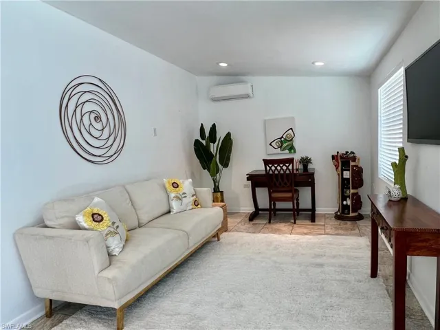 Florida Room/den, recessed lighting, baseboards, and light colored carpet