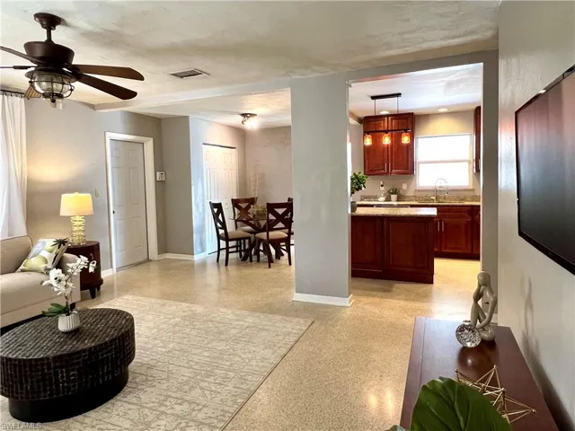 Open floor plan living room view to kitchen and dining