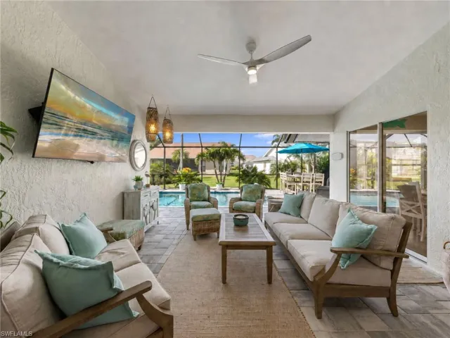 Relaxing oasis with views of the pool and tropical plants and trees