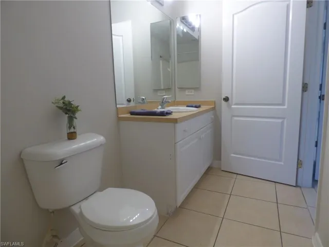 Master bathroom featuring vanity and light tile patterned flooring