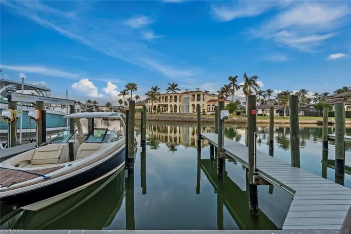 Dock featuring a water view and boat lift