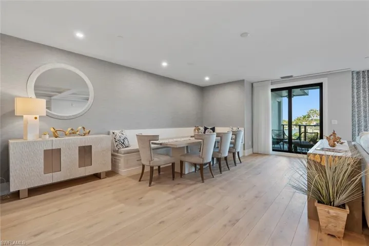 Dining space with light wood-type flooring and recessed lighting