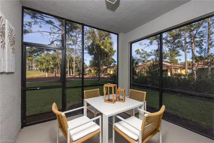 Sunroom / solarium featuring outdoor dining space
