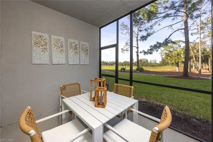 Sunroom / solarium featuring outdoor dining area