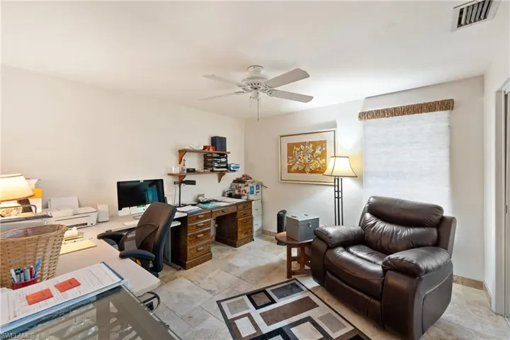 large bedroom/Office featuring ceiling fan and large closet