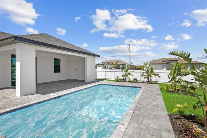 View of pool featuring a fenced in pool, fence, and a patio area