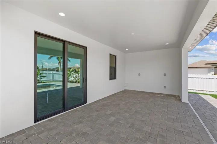 View of patio with fence