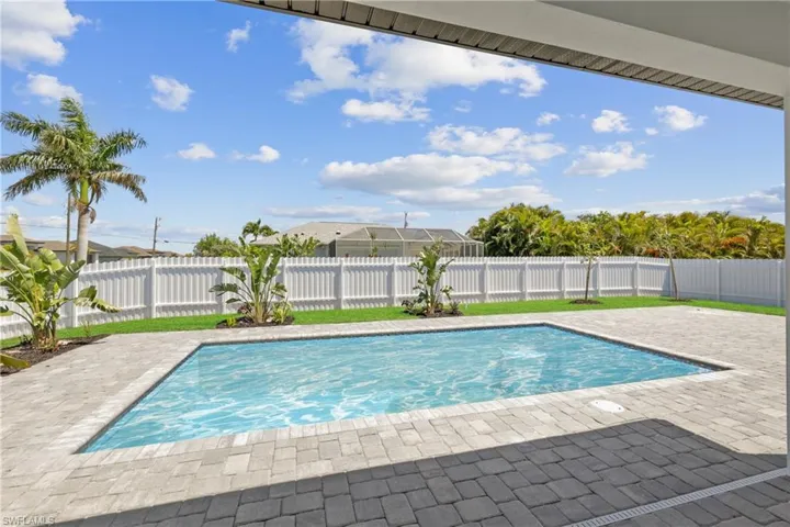 View of pool featuring a fenced backyard, a patio area, and a fenced in pool