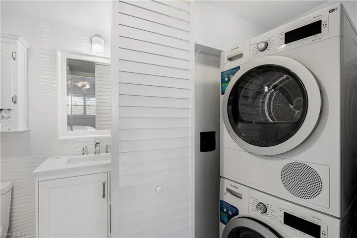 Laundry area with stacked washer / dryer