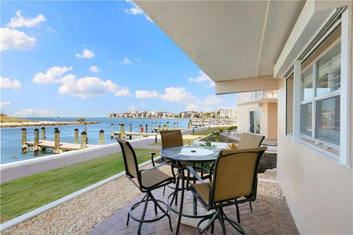 Balcony with a water view and a boat dock
