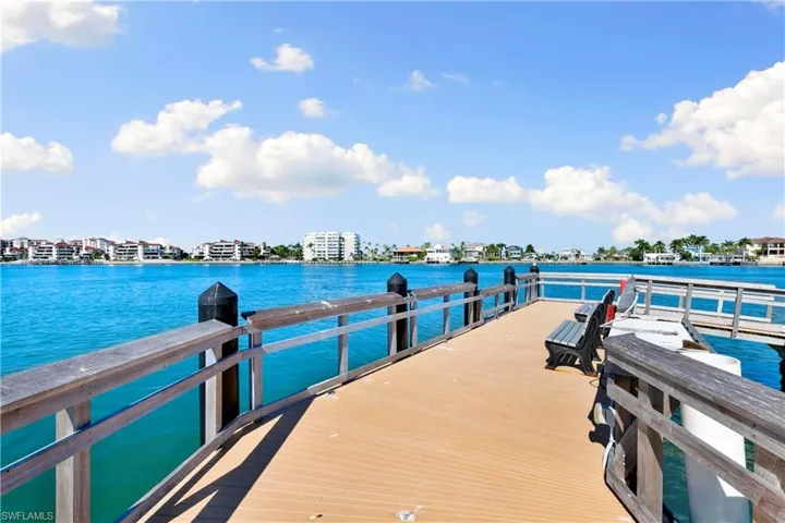 Dock area featuring a water view