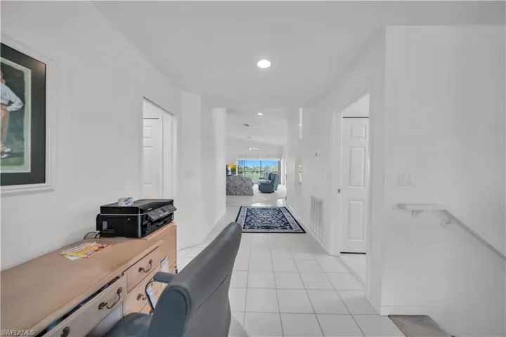 Home office featuring light tile patterned floors and recessed lighting