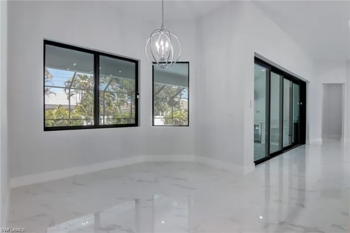 Empty room featuring a chandelier