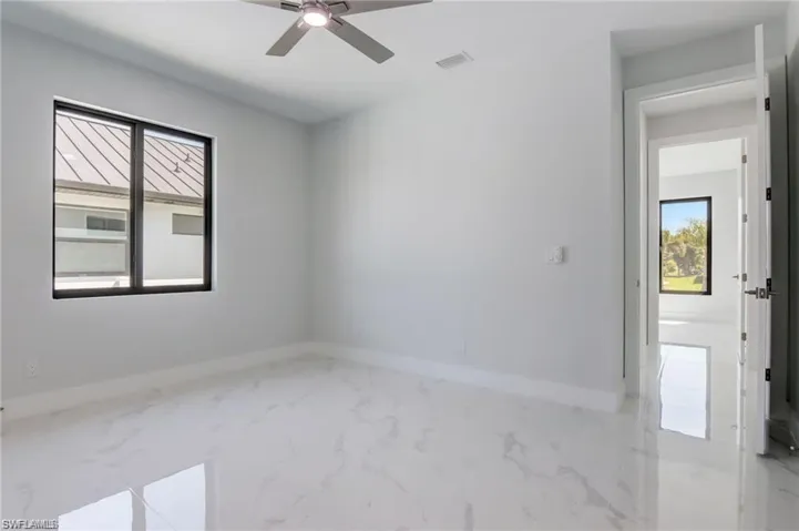 Spare room with ceiling fan