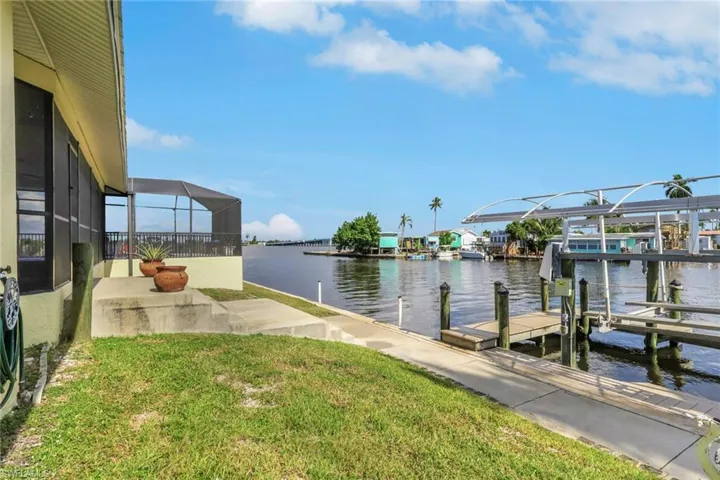 The home enjoys unobstructed views of Matlacha Pass and the large basin which becomes the Bayshore Canal!