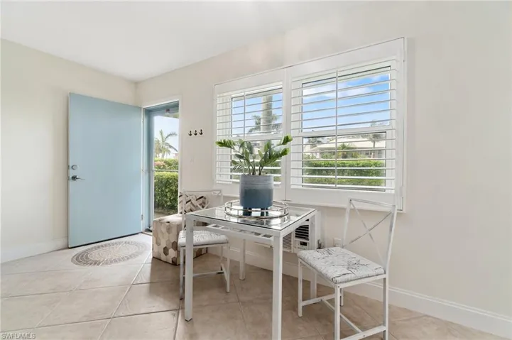 A dinette space has been created under the window.