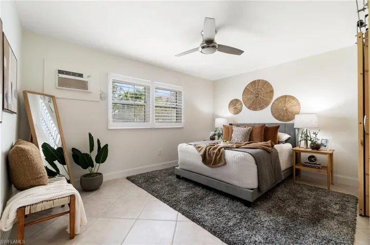 Plantation shutters allow for filtered light, and a new brushed nickel fan provides additional air.