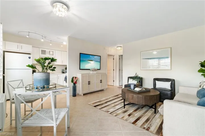 Neutral color palette, light, large porcelain tiles and modern light fixtures create a canvas to blend with any personal decor.