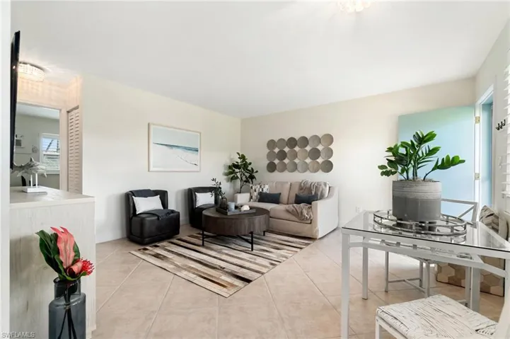 Living area featuring light tile patterned floors