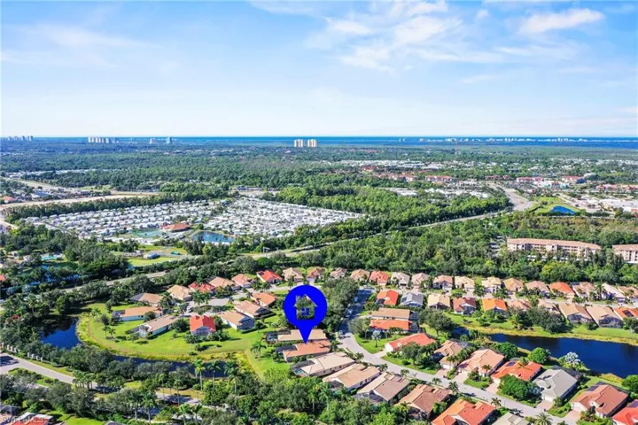 View of property location with nearby suburban area and a nearby body of water