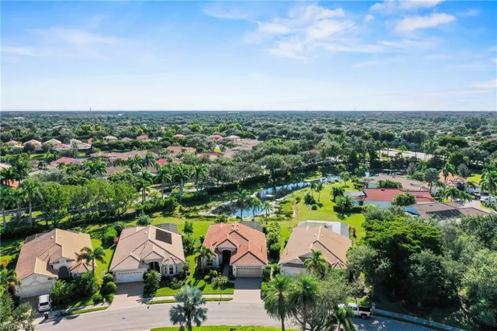 Aerial perspective of suburban area with a large body of water