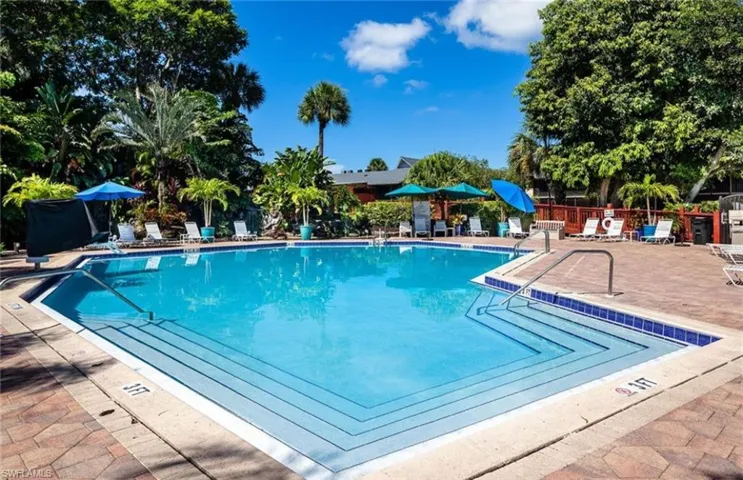 Community pool featuring a patio