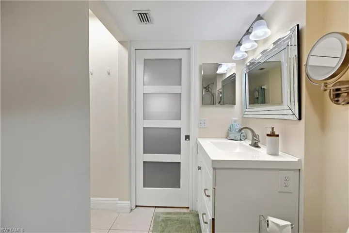 Bathroom with vanity and light tile patterned floors