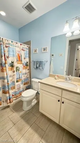Bathroom with vanity and toilet