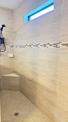 Bathroom with tiled shower