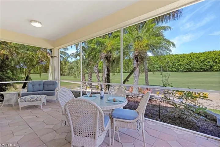 Sunroom / solarium featuring an outdoor living / dining area