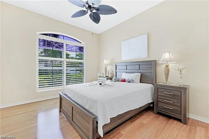 Bedroom with light wood-type flooring and a ceiling fan
