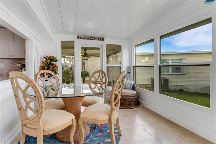 Sunroom featuring ceiling fan