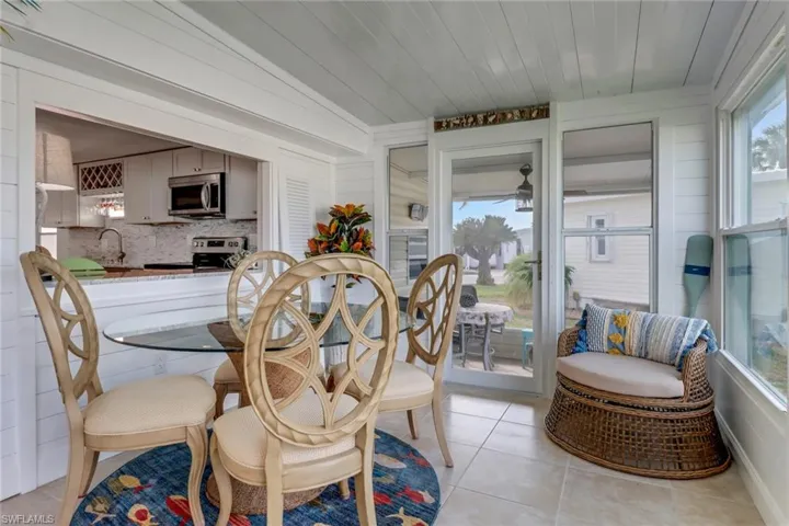 Dining room featuring sink and light tile floors