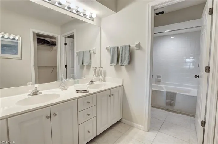 Bathroom with vanity and tile patterned floors