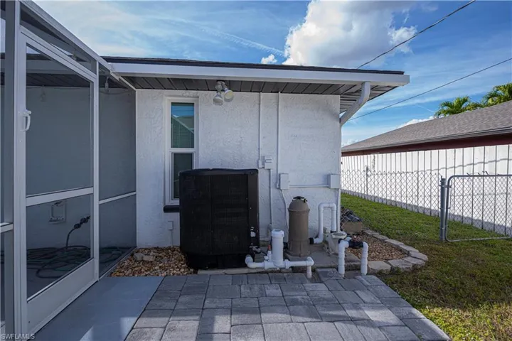 Property entrance featuring stucco siding and a patio