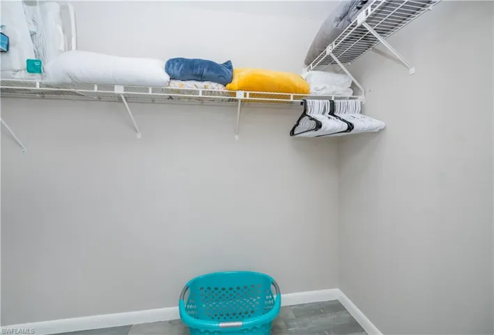 Spacious closet featuring wood finished floors
