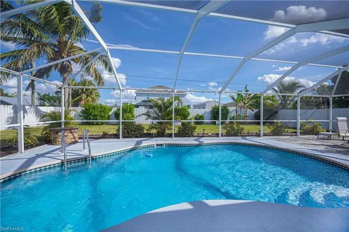 View of pool featuring a lanai, a sunroom, and a patio area