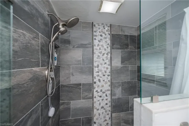 Bathroom with tiled shower