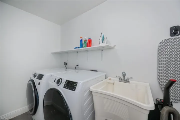 Washroom featuring washing machine and clothes dryer