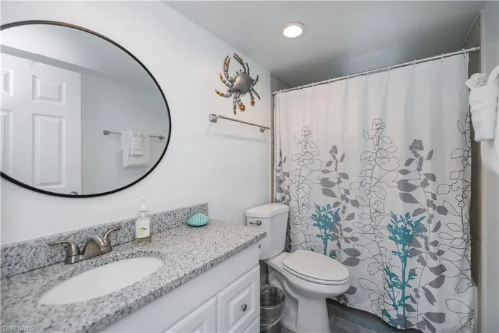 Bathroom featuring vanity, a shower with curtain, and recessed lighting