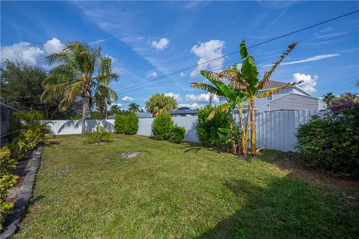 View of fenced backyard