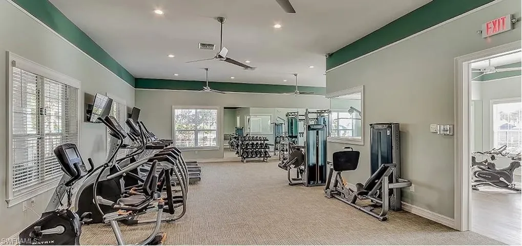 Workout area featuring a ceiling fan and recessed lighting