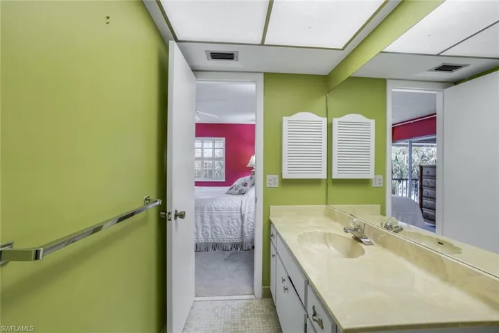Primary bathroom with large vanity and tile floors