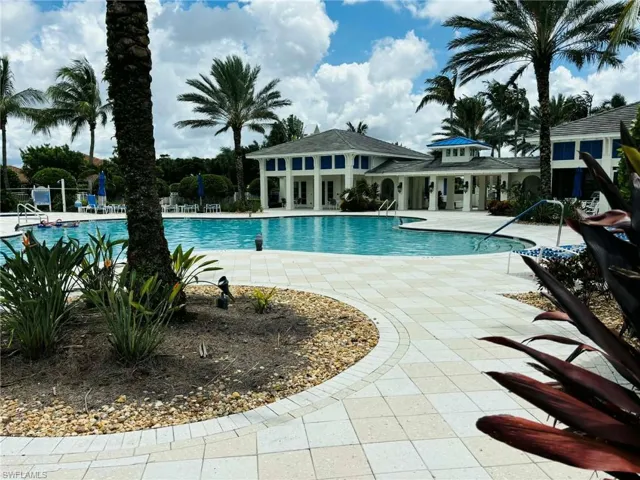 Community pool featuring a patio
