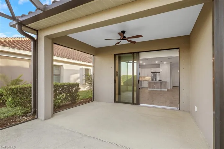 View of patio featuring ceiling fan
