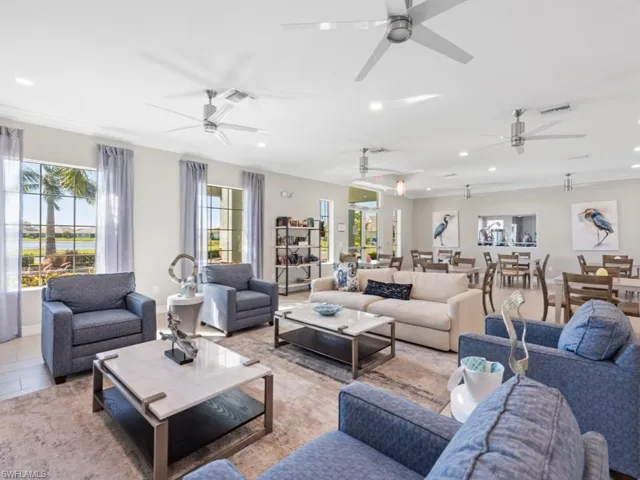 Living room featuring ceiling fan, visible vents, and recessed lighting